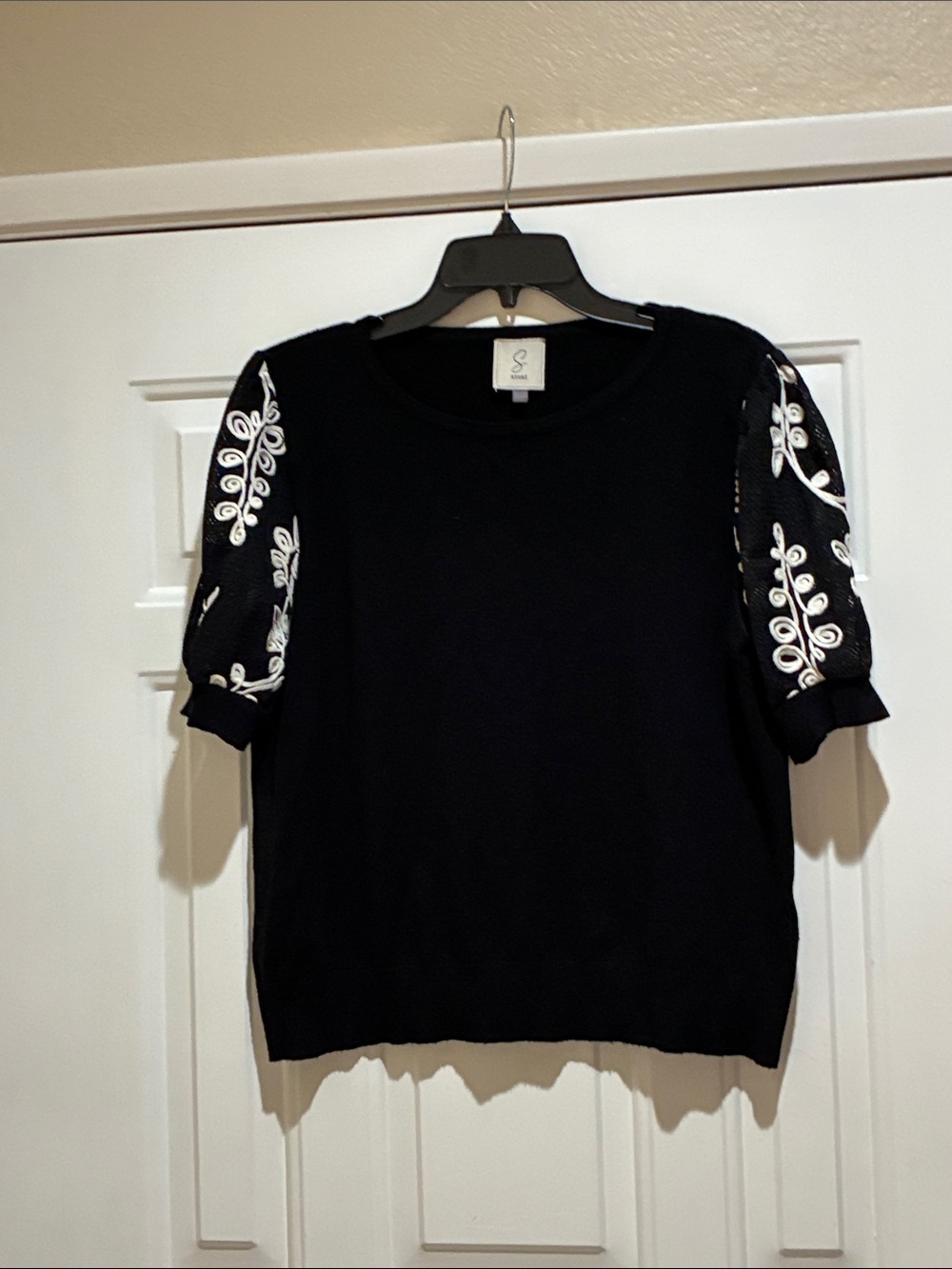 Sioni black crew neck short sleeve sweater with embroidered sleeve